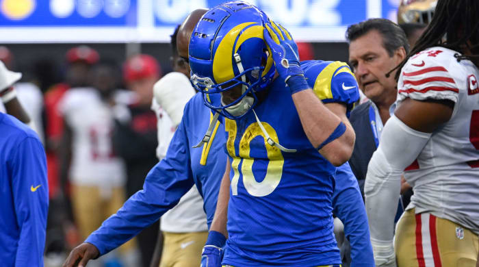 Cooper Kupp walks off the field after sustaining an apparent injury.